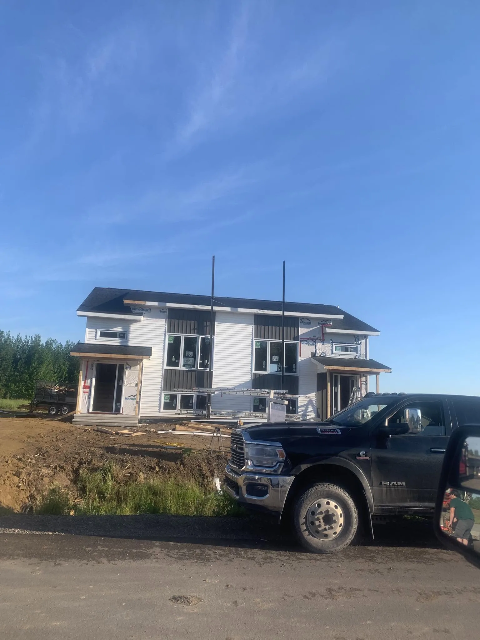 CG Drywall truck parked at a new build