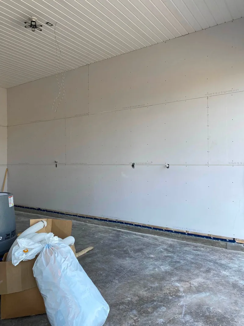 Long commercial wall, board hung and screwed off