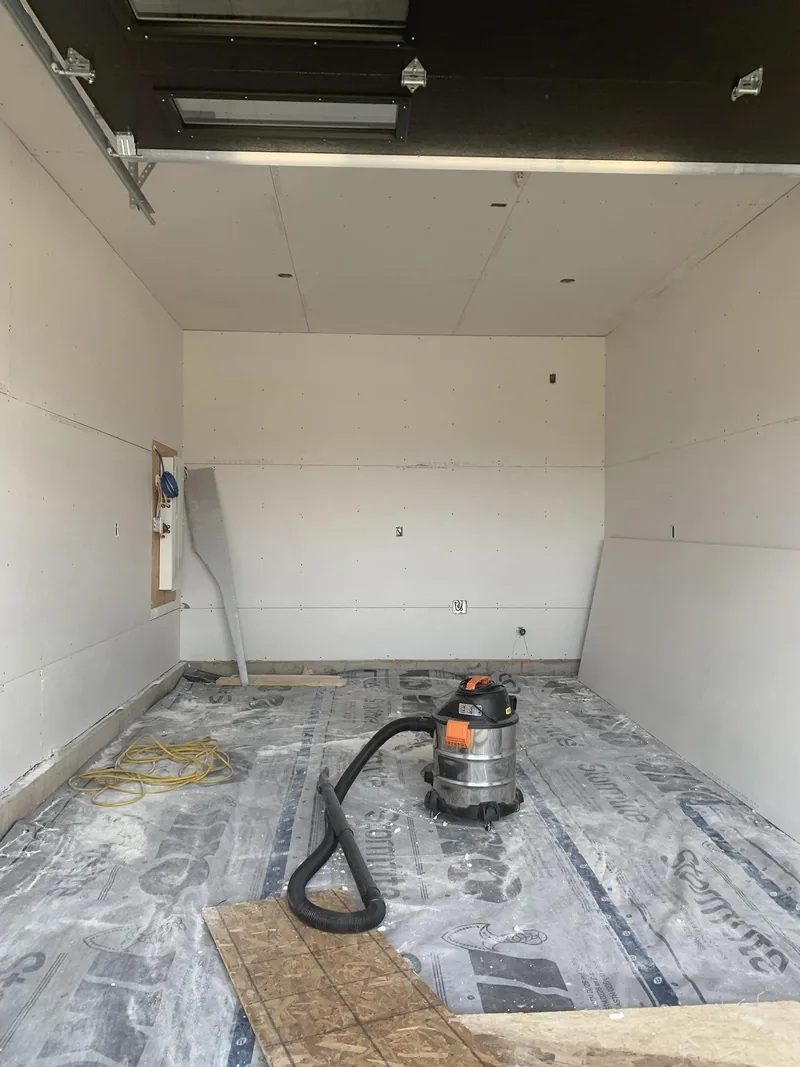 Residential garage, boarded and cleaned up